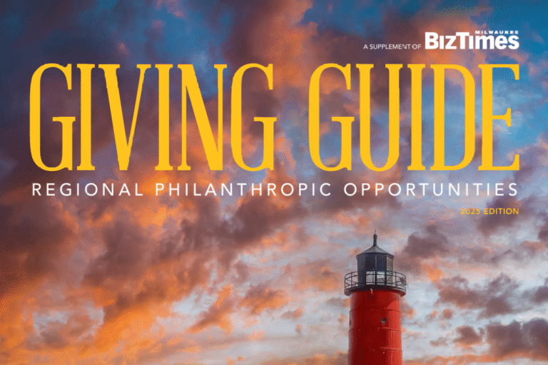 Image of the cover of the 2024 BizTimes Giving Guide, featuring gold text and a red lighthouse on a sky background.