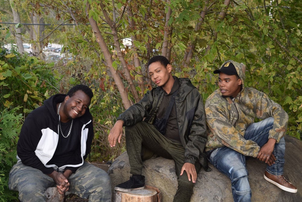Three boys in the woods